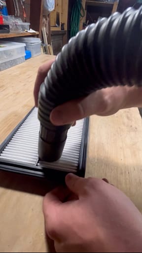 vacuuming air filter
