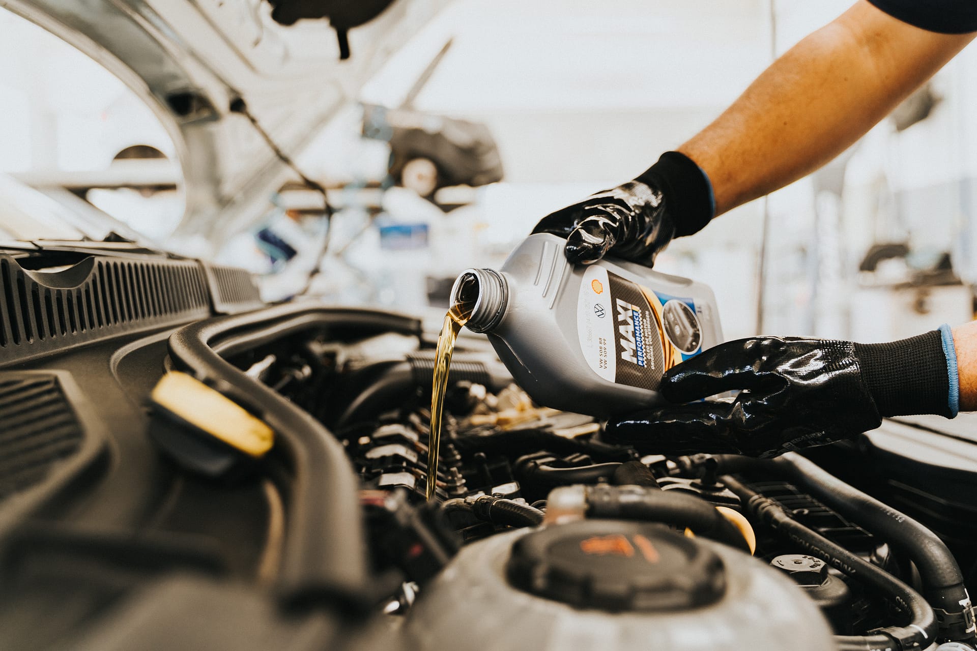pouring oil in car